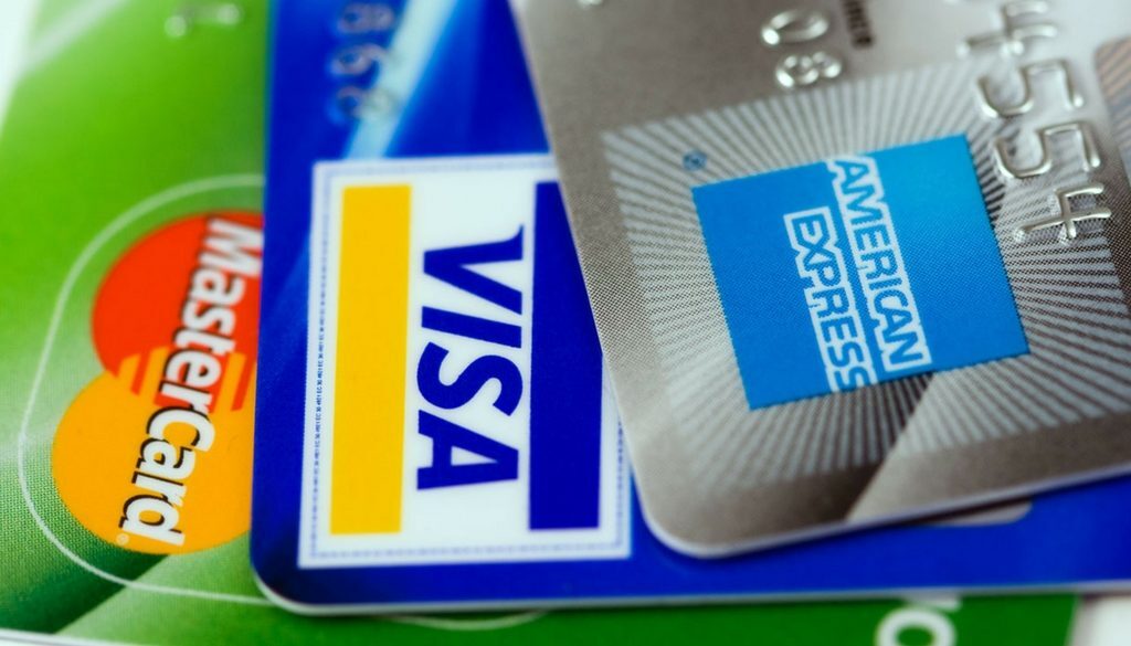 Close-up of Mastercard, Visa, and American Express credit cards used for financial planning with fiduciary advisors in Wisconsin.