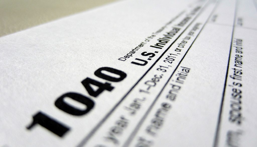 Close-up of a U.S. 1040 tax form, highlighting tax planning and accounting services in Wisconsin for Advisors Management Group.