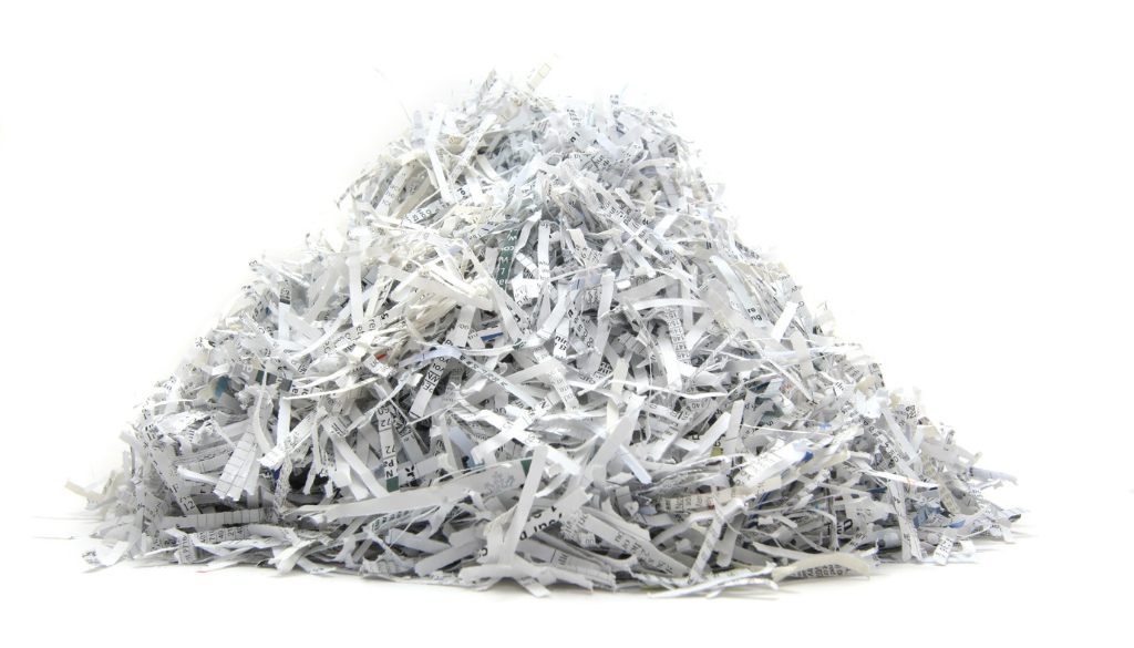 Shredded financial planning documents reflect secure information handling by fiduciary financial advisors in Wisconsin.