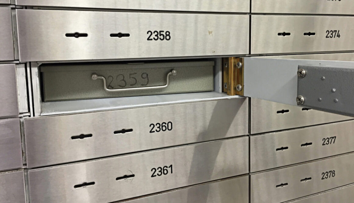 An open safety deposit box labeled 2359 is visible in a Wisconsin financial planning vault at Advisors Management Group.