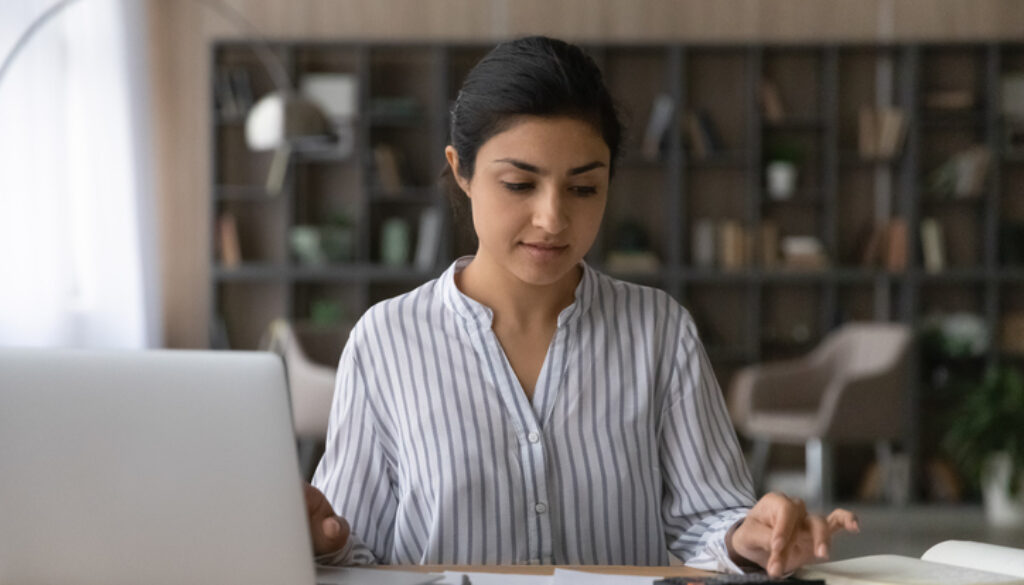 A woman at a computer planning for the future of her special needs child.